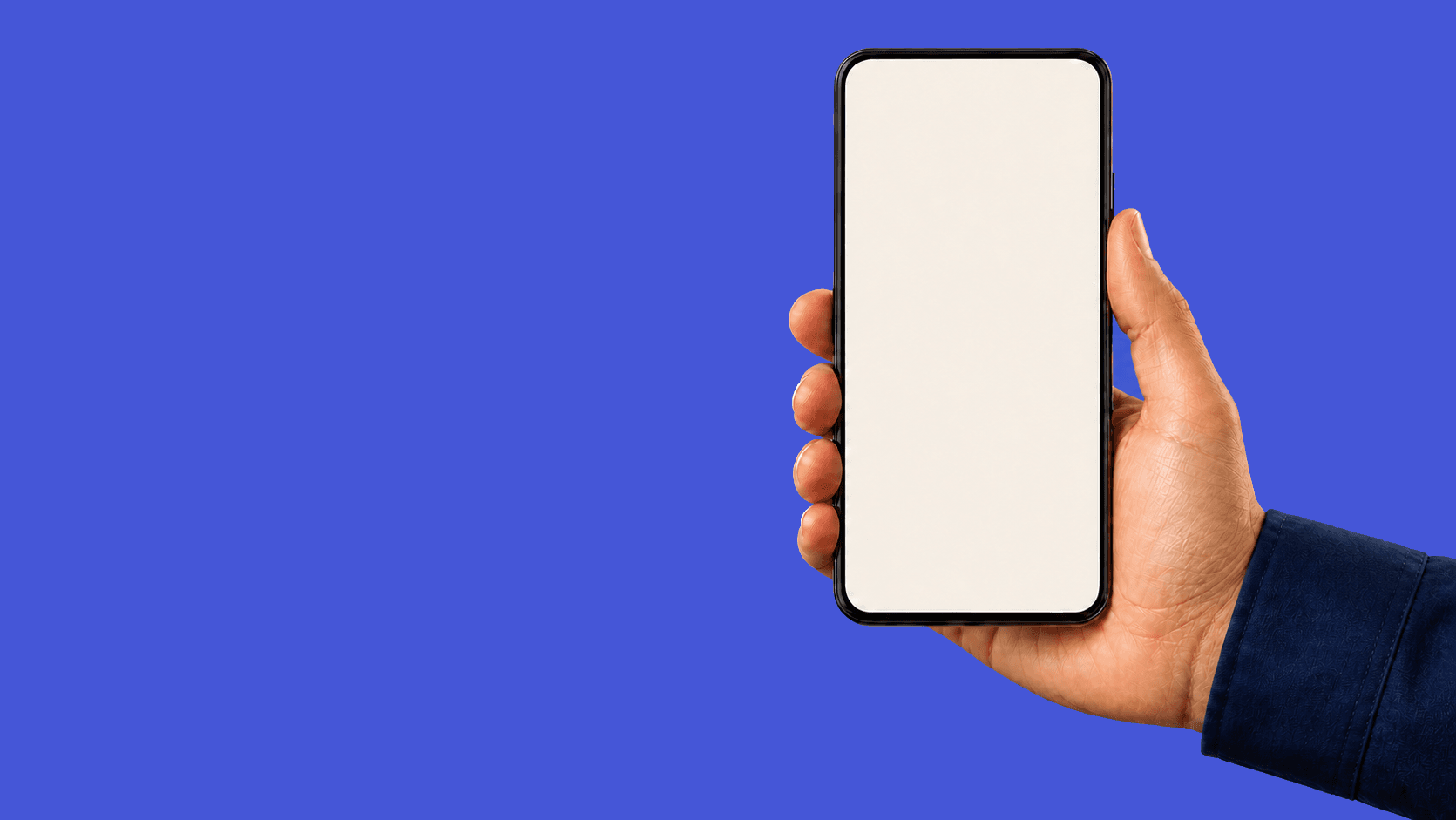A male field worker's hand holding a phone on a blue background
